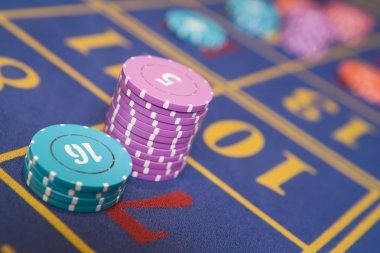 Live blackjack table on mobile phone showing dealer and player cards